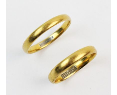 Two 22ct gold wedding bands, both with plain polished exterior with 'fidelity' engraved to interior, one ring size K, the oth