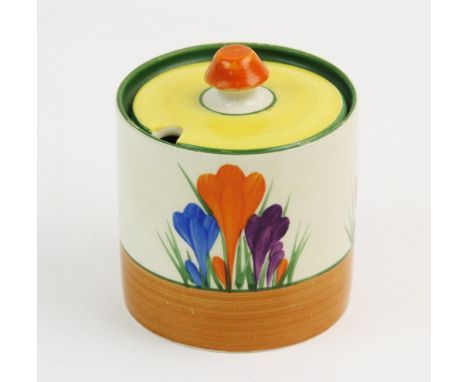 A Clarice Cliff for Newport Pottery Bizarre range Crocus pattern preserve jar and cover, early 20th century, the jar of drum 