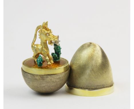 A novelty silver gilt surprise Easter egg, Stuart Devlin, London 1978, no. 50/100, the wrythen body revealing an enamel and g