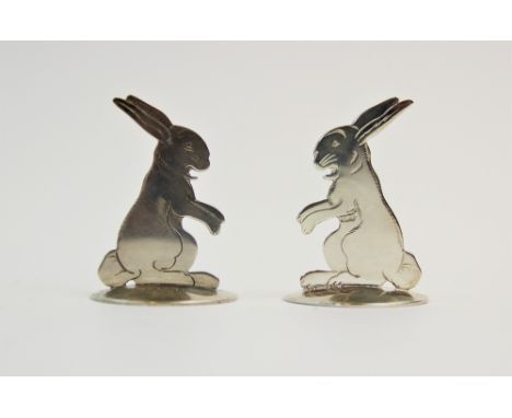 A pair of silver place card holders, Sampson Mordan & Co Ltd, Chester 1912, each designed as a rabbit 'Roudoudou', after desi