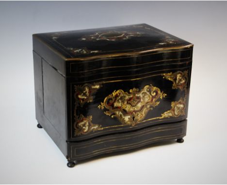 A 19th century black lacquer and boulle work decanter box, of serpentine form the hinged top centred with a brass, boulle and