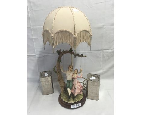 PAIR OF COFFEE TINS &amp; A FIGURE TABLE LAMP WITH SHADE