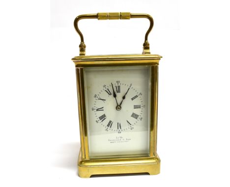 A BRASS CASED CARRIAGE CLOCK  the enamel dial with Roman hour markers and Arabic minutes, inscribed 'exd by Evershed &amp; So