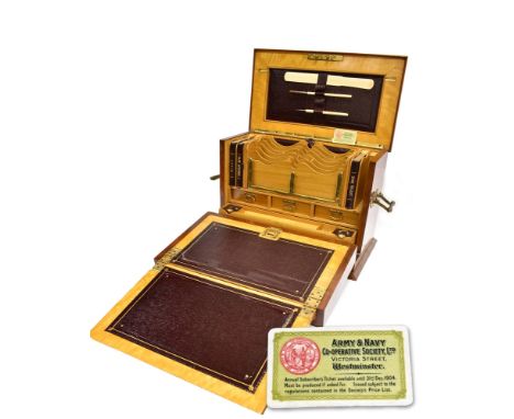 AN EDWARDIAN TRAVELLING STATIONERY BOX with gilt metal carrying handle to each side, with Bramah type lock and key, the top o