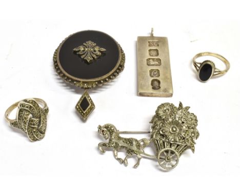 FIVE ITEMS OF SILVER JEWELLERY comprising a marcasite and black onyx oval pendant brooch, a marcasite set watch brooch, the w
