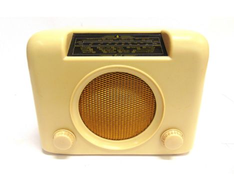 A BUSH DAC 90A RADIO  cream, serial no.73/61681; together with three Worcester Ware printed aluminium storage jars, circa 195