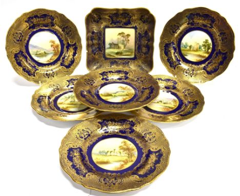 A SET OF SIX CABINET PLATES  all painted to centres with topographical scenes on a blue ground with gilt decoration, 23cm dia