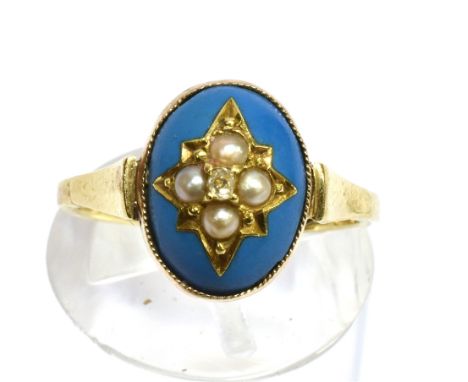 A LATE VICTORIAN TURQUOISE, SEED PEARL AND DIAMOND SET RING  the oval cabochon cut turquoise inset with a yellow gold star de