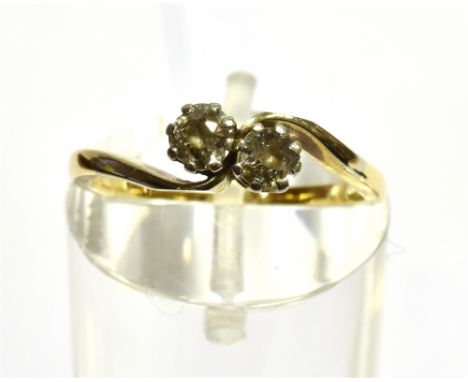 A DIAMOND TWO STONE CROSSOVER 18CT GOLD RING  two round brilliant cut diamonds weighing a total of approx. 0.30 carat, claw s