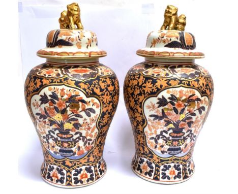 A PAIR OF LARGE CONTEMPORARY LIDDED VASES  of baluster form, decorated in the Imari palette, the knops modelled as dogs of Fo