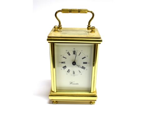 A BRASS CASED CARRIAGE CLOCK  the enamel dial with Roman hour markers and Arabic minutes, signed 'Worcester', 13cm high
