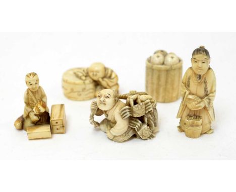 A Japanese carved ivory netsuke in the form of a seated man with large drum, 3.5cms; another in the form of a fisherman with 