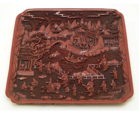 A Chinese cinnabar lacquer square tray, carved with figures, pagodas, boats and islands on a ground of diaper and waves, squa