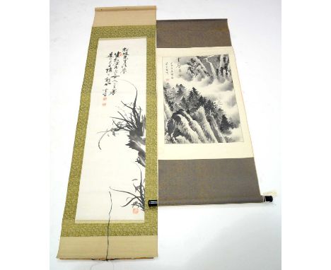 A Chinese monochrone scroll painting, decorated in black with landscape, signed and titled, 65cmsx43cms; and another with cal