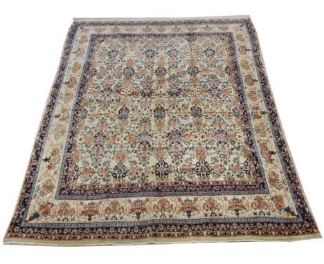 A fine Bidjar carpet, decorated with repeated floral sprays and medallions, 330 x 240cms. 