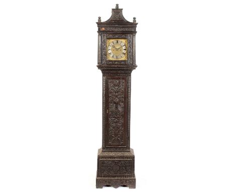 Ion (Jon) Ellis of Sherbourne: an ebonised and carved oak longcase clock, the 10in. (25cm) dial with silvered chapter ring, m