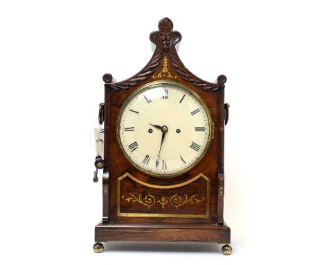 A George IV rosewood and brass inlaid bracket clock, the painted roman dial with twin fusee movement striking on a gong, pull