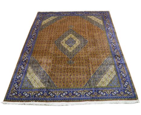 An Abadeh carpet, the central diamond-shaped medallion and surround with repeated floral decoration, 339 x 247cms.