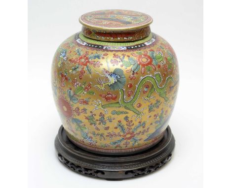 A late 18th Century Chinese blue and white ovoid jar and cover, with European 'clobbered' decoration decorated with dragons, 