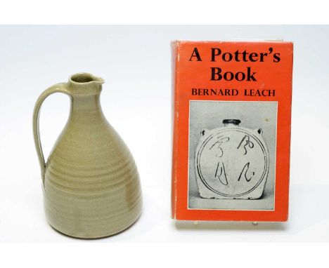 A St. Ives pottery stoneware jug of ribbed bottle kiln form with applied strap handle, pale olive-green glaze, impressed St I