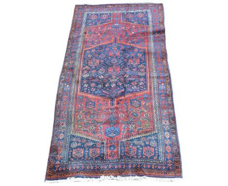 A Bidjar carpet, the central panel and outer ground with geometric floral design, 266 x 132cms.