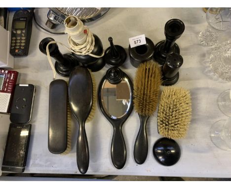 A COLLECTION OF EBONY BRUSHES, MIRRORS, CANDLE STICK, LAMP BASE ETC 