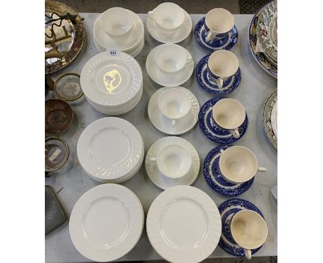 A COLLECTION OF WHITE CERAMIC TEA CUPS, SAUCERS AND SIDE PLATES TOGETHER WITH SOME BLUE AND WHITE EXAMPLES 