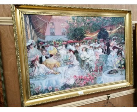 A LARGE DECORATIVE GILT FRAMED PRINT OF A DINING SCENE 