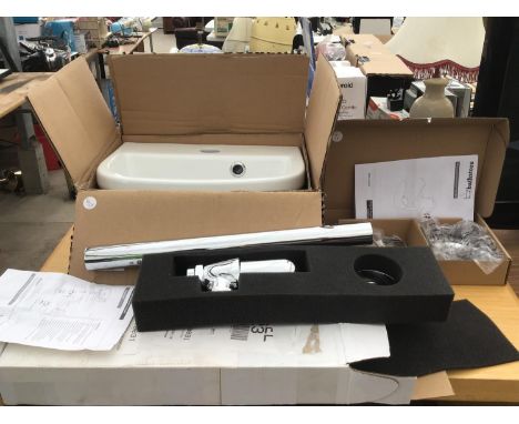 A NEW AND BOXED SMALL BASIN, A NEW CHROME BOTTLE TRAP AND A NEW BOXED TAP 
