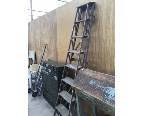 A VINTAGE SEVEN RUNG WOODEN STEP LADDER (REPAIRED) 