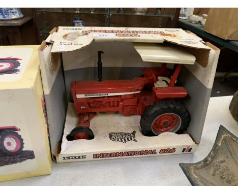 A BOXED ERTL INTERNATIONAL 826 RED TRACTOR MODEL 