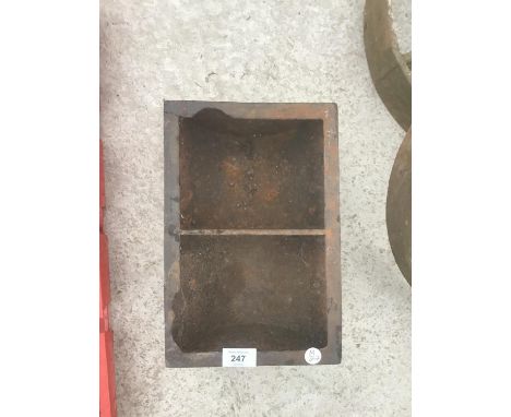 A SMALL TWO SECTION CAST IRON TROUGH 