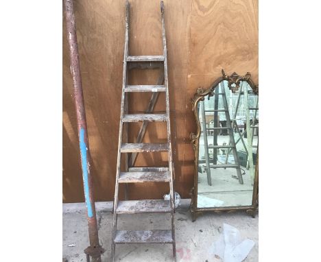 A VINTAGE SEVEN RUNG WOODEN STEP LADDER 