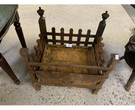 A VINTAGE CAST METAL FIRE GRATE 