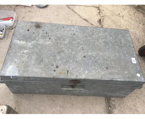 A METAL 'ABBAS STEEL TRUNK FACTORY DUBAI UAE' TRUNK WITH SIDE CARRY HANDLES 