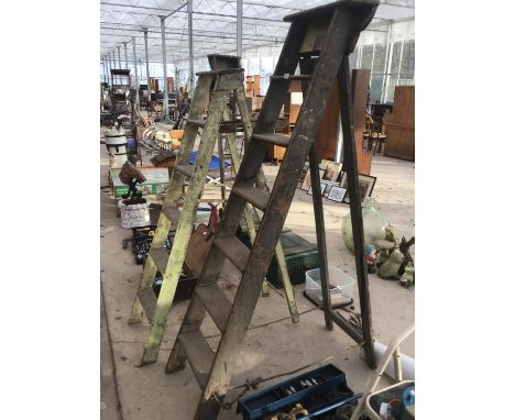 TWO VINTAGE WOODEN STEP LADDERS ONE SEVEN RUNG AND ONE SIX RUNG 