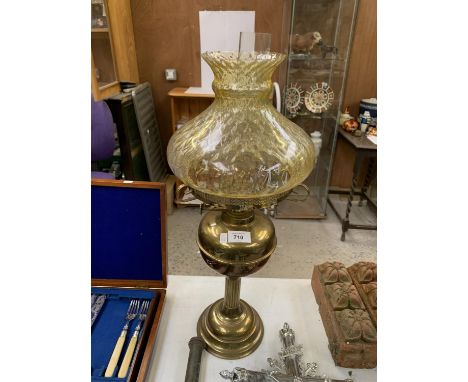A BRASS COLUMN DESIGN OIL LAMP WITH GLASS SHADE AND FUNNEL 