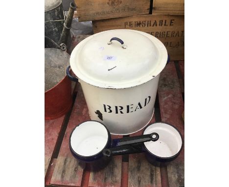 AN ENAMEL BREAD BIN AND TWO PANS 