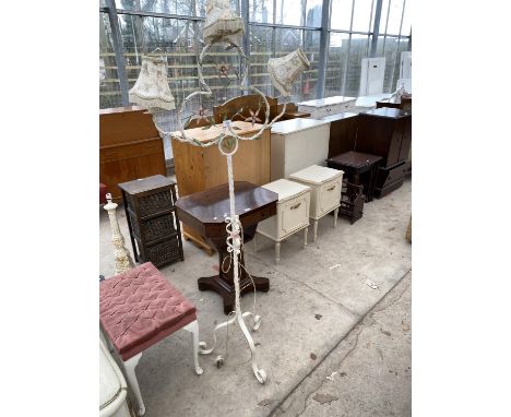 AN ORNATE WROUGHT IRON THREE BRANCH STANDARD LAMP WITH FLORAL DECORATION 