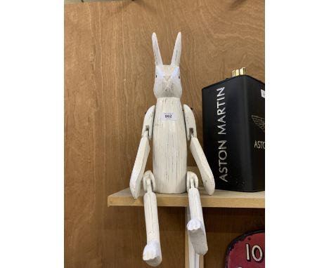 A WHITE WOODEN SHELF RABBIT 