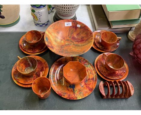 AN ART DECO ORANGE MARBLE PRINT BAKELITE TEA SET TOGETHER WITH CUPS, SAUCERS, SIDE PLATES, FRUIT BOWL ,TOAST RACK ETC 