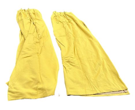 A PAIR OF YELLOW LINED CURTAINS, 285cm x 240cm