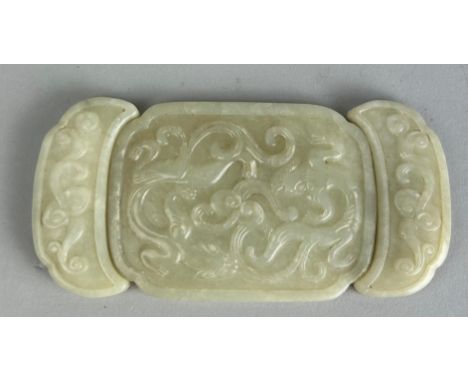 A CHINESE JADE BELT BUCKLE, In three parts. When together 10cm x 5cm