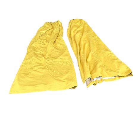 A PAIR OF YELLOW LINED CURTAINS, 285cm x 220cm