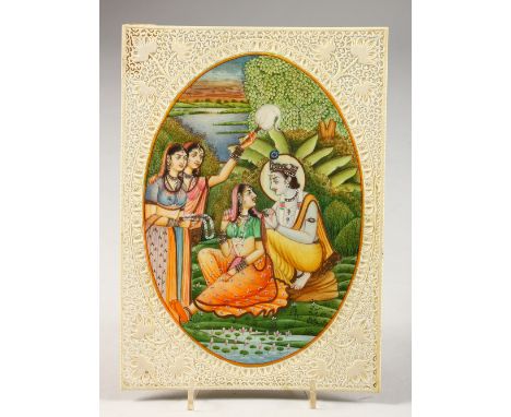 AN INDIAN IVORY MINIATURE, in a pierced surround. 8ins x 5.5ins.