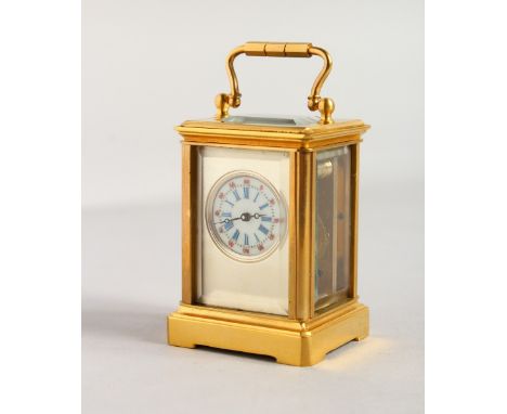 A MINIATURE PLAIN CARRIAGE CLOCK. 2.5ins.
