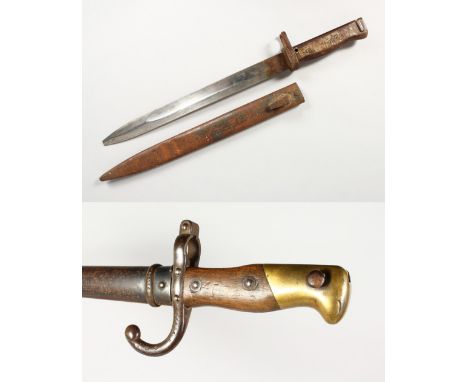 A FRENCH GRAS BAYONET, dated 1877, wood grips, brass pommel, in scabbard, 26ins; and a German Ersatz Bayonet, steel hilt and 