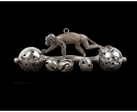 A sterling silver baby rattle a topped by a cast model of a monkey, Birmingham 1912. 