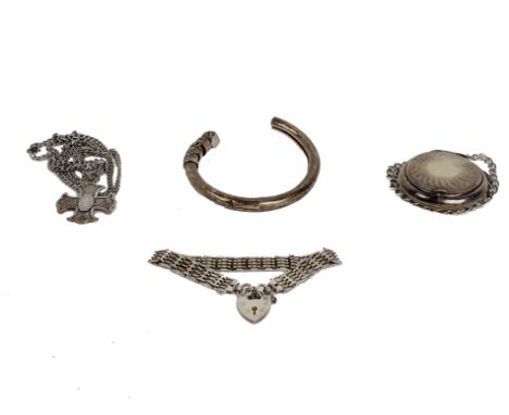 A collection of white metal and sterling silver items to include a gate link bracelet, bangle bracelet and a necklace.
