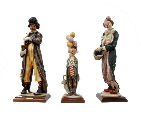 Three resin model clowns by G Armani, Florence one dated 1997 tallest 46cm each on wooden bases